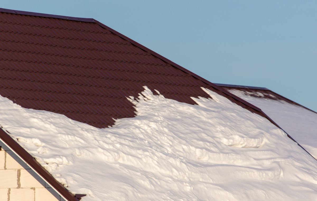 Brick House With Snow On The Roof