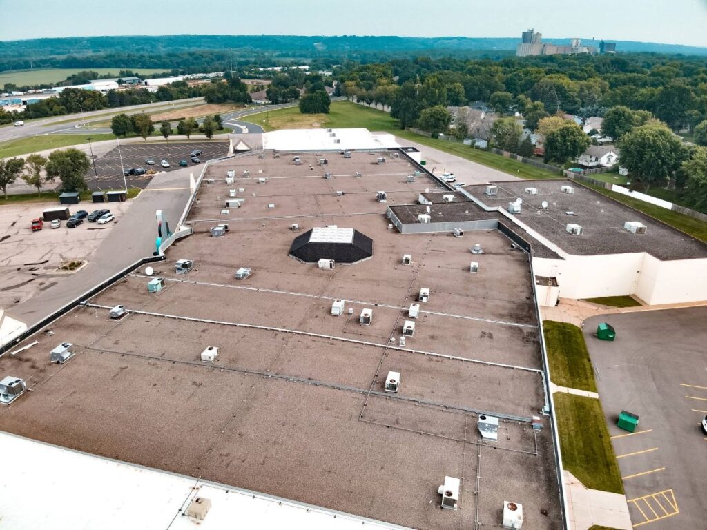 Aerial view of a flat commercial roof on a large commercial building