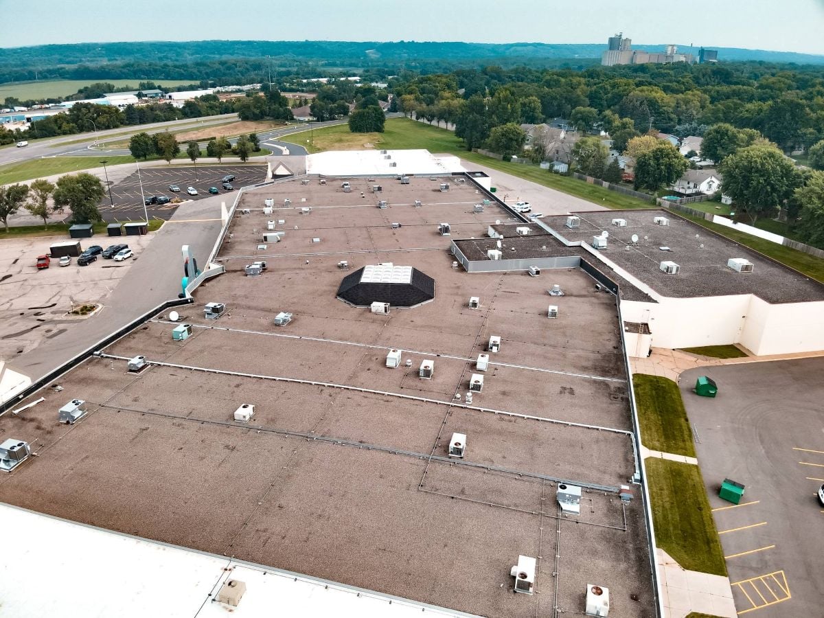 Aerial view of a flat commercial roof on a large commercial building