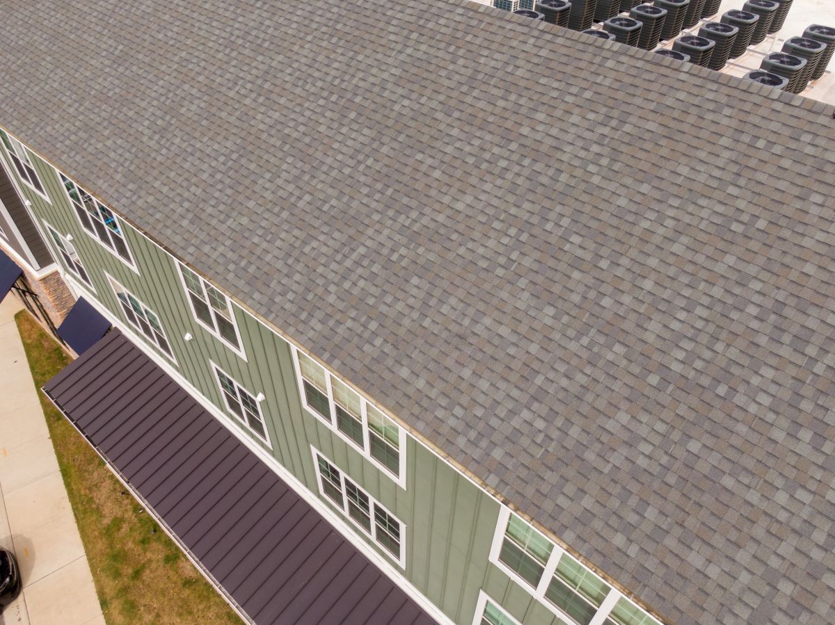 Close Up Of Shingle Roof On Apartment Buildings