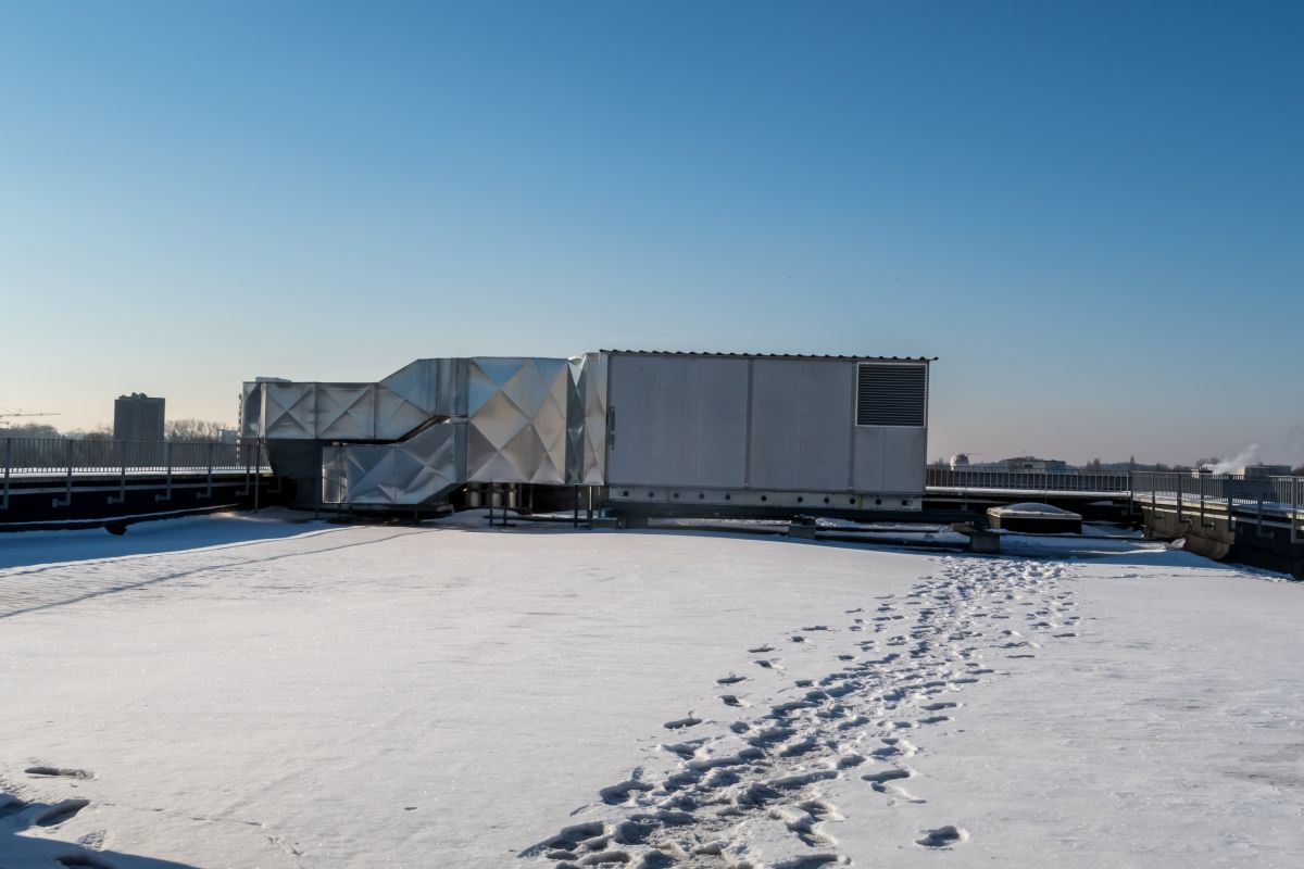 Flat Commercial Roof Covered In Snow