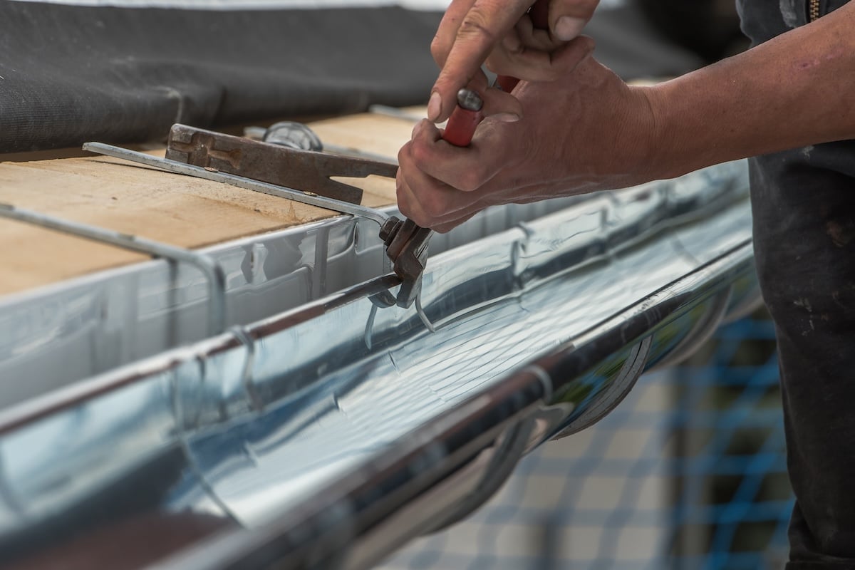 Close Up Of A Newly Installed Gutter On A Roof.