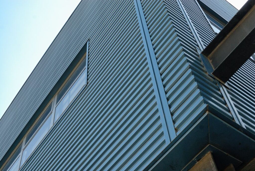 Blue Metal Exterior Siding Of A Building.
