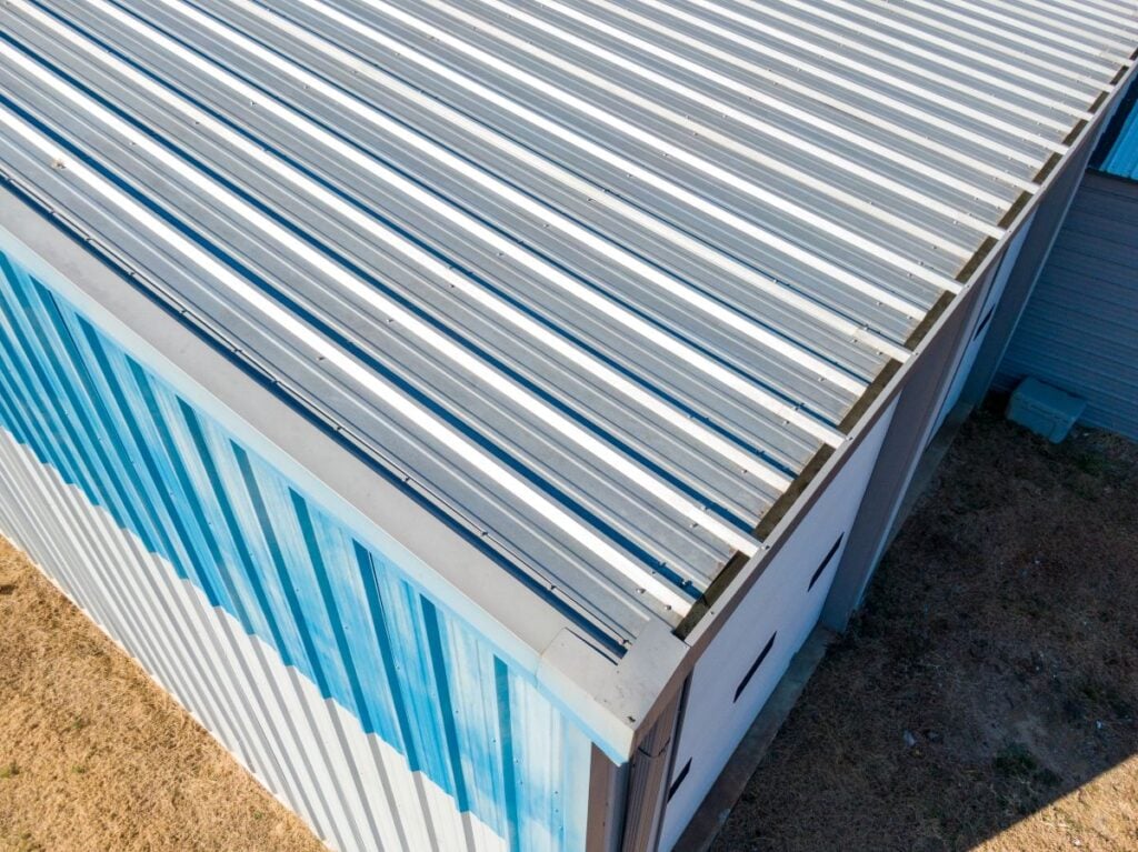 High Resolution Aerial Drone View Of Gray Standing Seam Metal Roof On Commercial Building