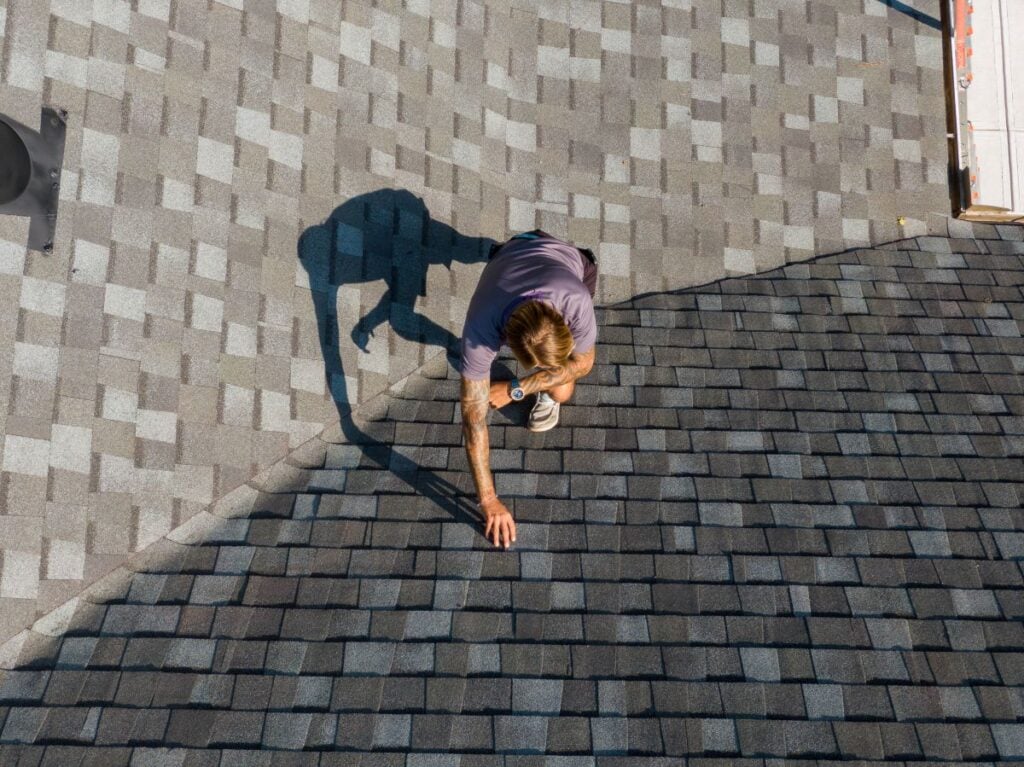 Roofing Project Manager Performing A Residential Roof Inspection