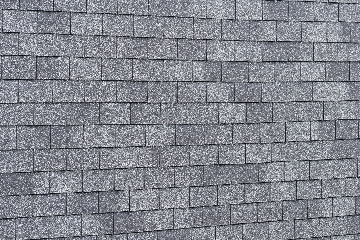 Close Up Of Grey 3 Tab Shingles. Architectural Shingles vs 3 Tab: 4 Key Differences Explained