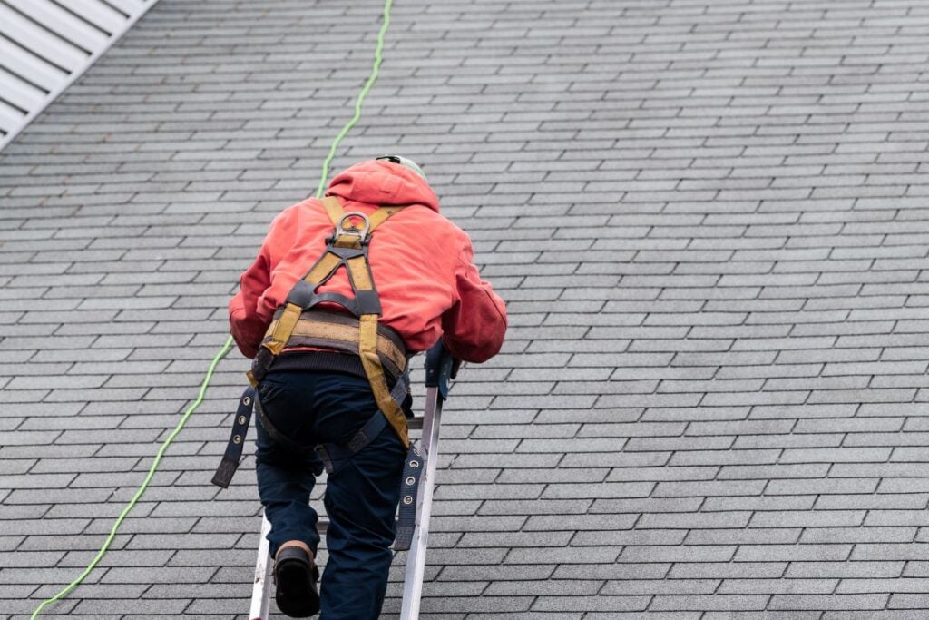 Complete Roof Inspection. Man Inspecting A Roof