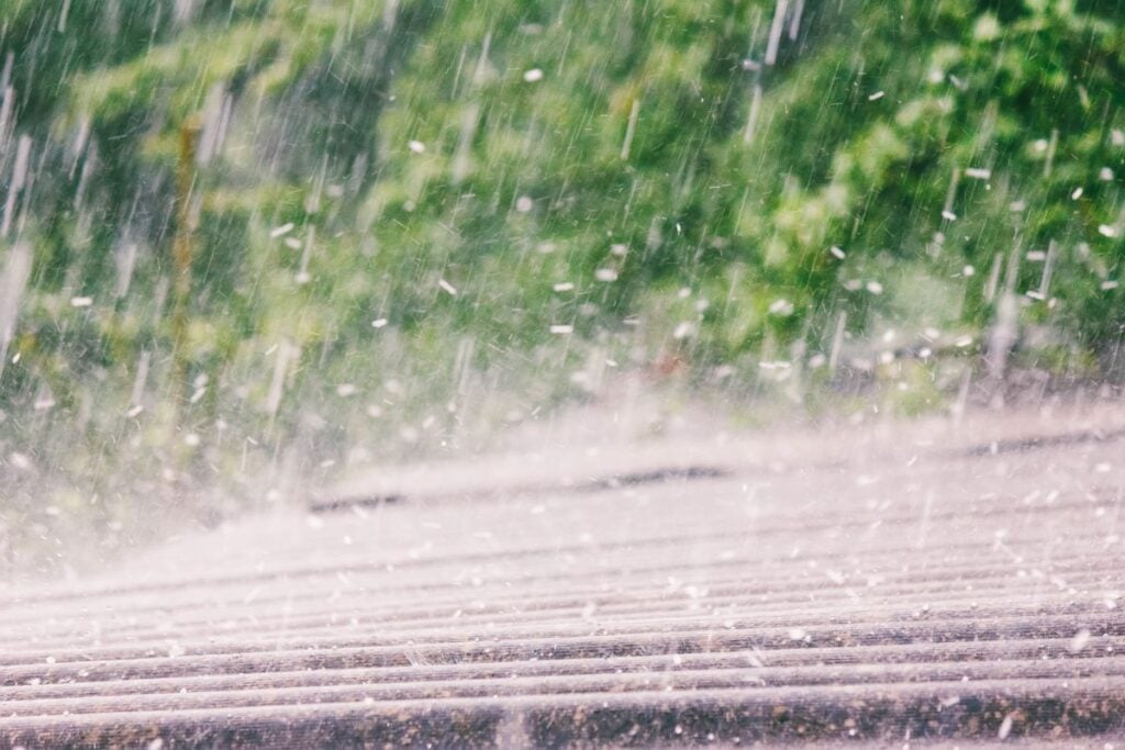 Summer Rain With Hail Falls On The Roof Of Slate