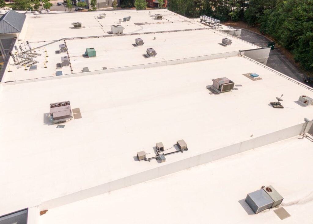 Drone Images Of Tpo Flat Roofs On Commercial Building. TPO Roofing Cost
