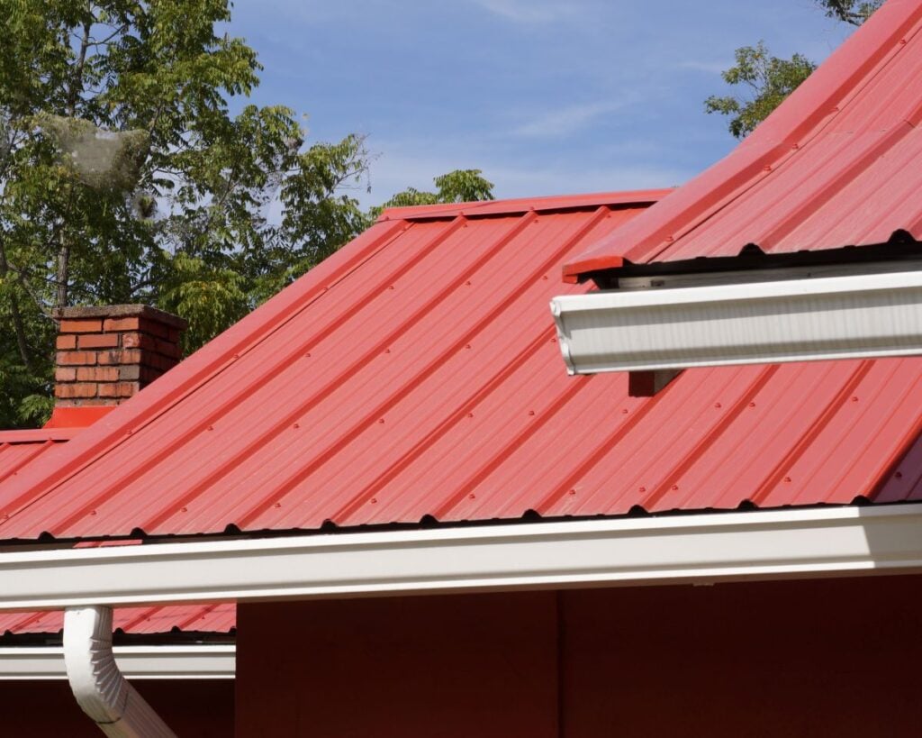 Red Metal House Roof. How Long Do Metal Roofs Last?