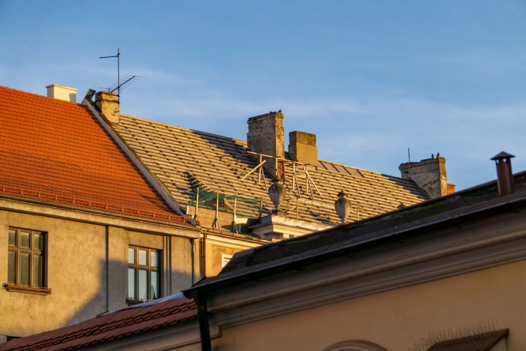 Replacing The Roof On An Old Tenement House. Multi Family Roof Replacement